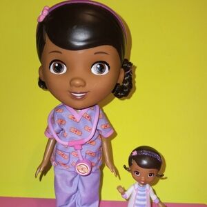 Doc Mcstuffins Doll in purple & pink  scrubs with a mini doc